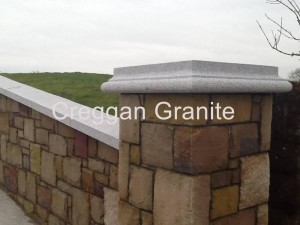Silver grey granite pier cap and wall coping.