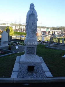 Silver-grey granite sculpture of Our Lady of Lourdes 